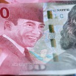 Ilustrasi mata uang rupiah dan dolar AS-1659065249