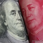 Mata uang Dolar AS dan Yuan China. (Foto/ANTARA/Shutterstock/rustamxakim/aa)-1668741754